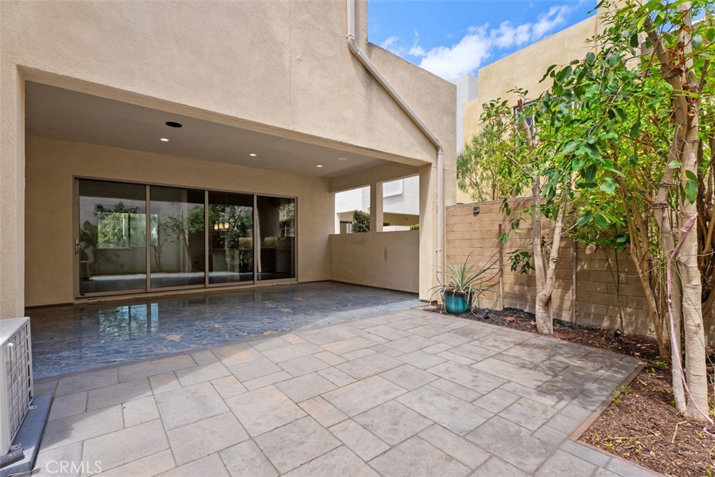 123 Interval Irvine, CA 92618 - Photo 20 of 75 a view of a patio with table and chairs and potted plants