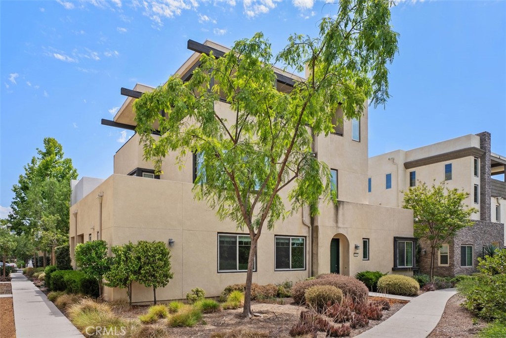 123 Interval Irvine, CA 92618 - Photo 2 of 75 a front view of a house with a yard