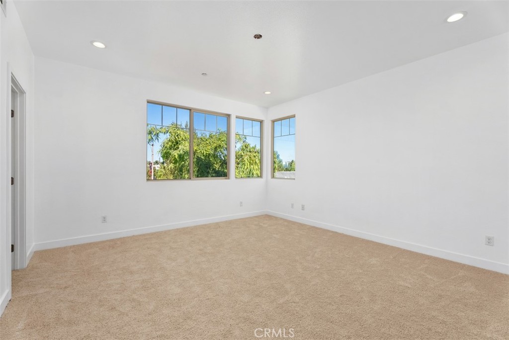 123 Interval Irvine, CA 92618 - Photo 28 of 75 an empty room with windows and closet
