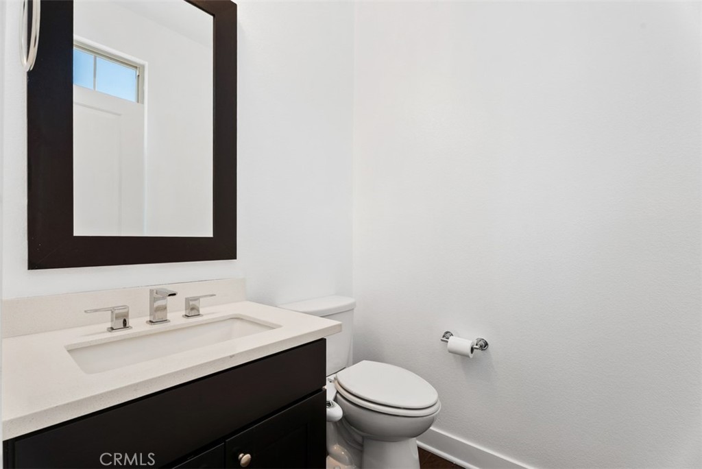 123 Interval Irvine, CA 92618 - Photo 40 of 75 a bathroom with a sink and a toilet