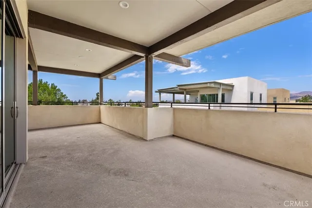 a view of a house with patio and a garden