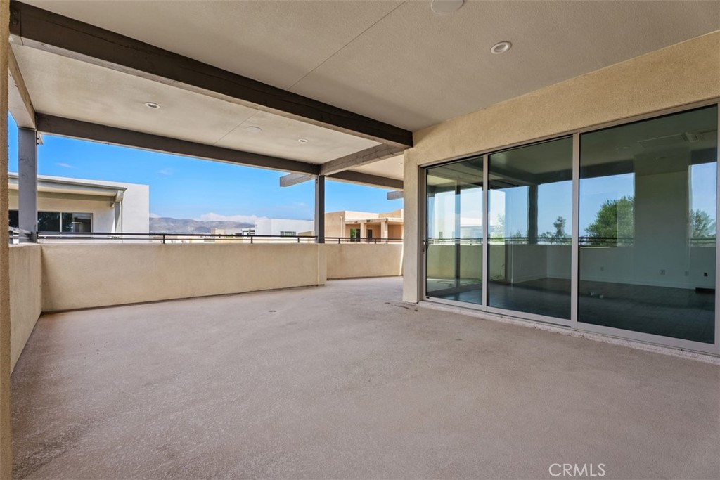 123 Interval Irvine, CA 92618 - Photo 44 of 75 a view of a big room with wooden floor and sliding door