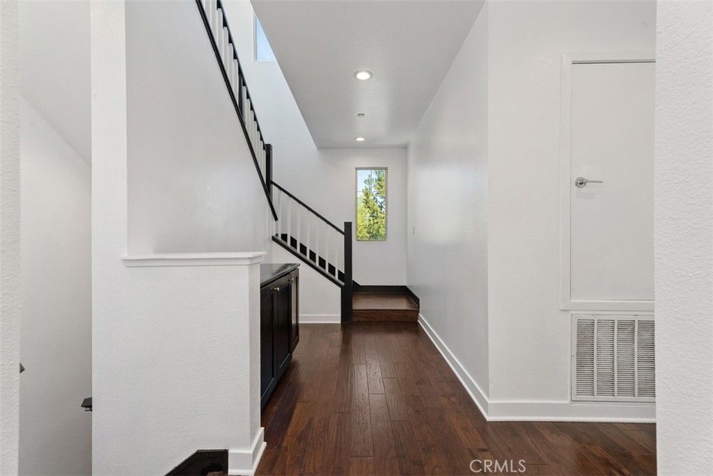 123 Interval Irvine, CA 92618 - Photo 47 of 75 a view of entryway with wooden floor