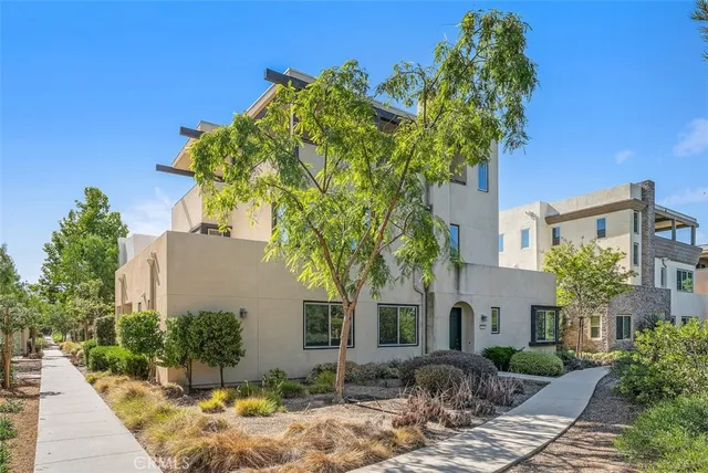 a view of a balcony with chairs and a patio