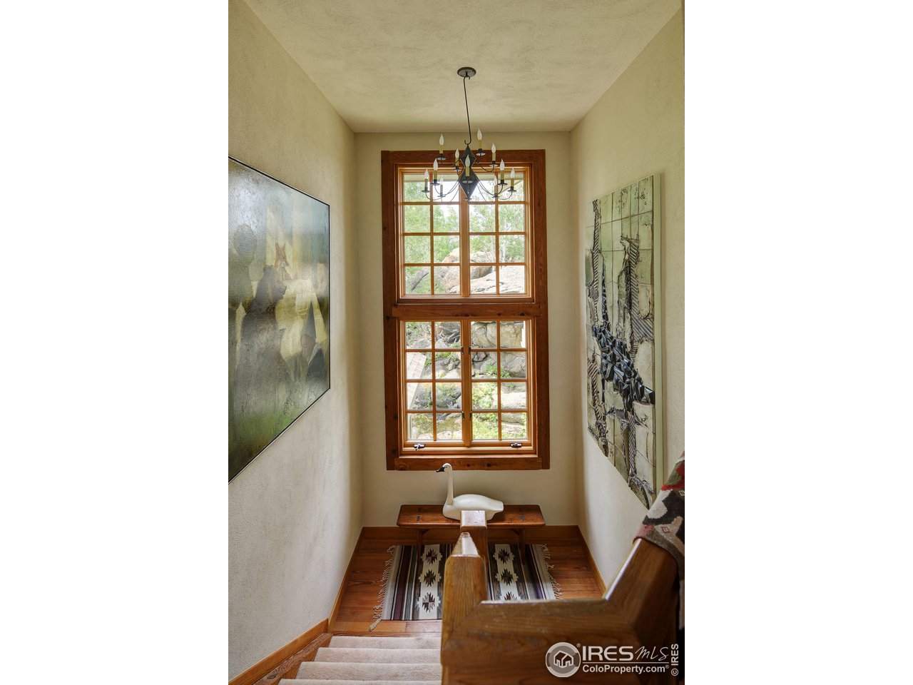 6171 Flagstaff Road Boulder, CO 80302 - Photo 15 of 40 a picture of a room with a window and wooden floor