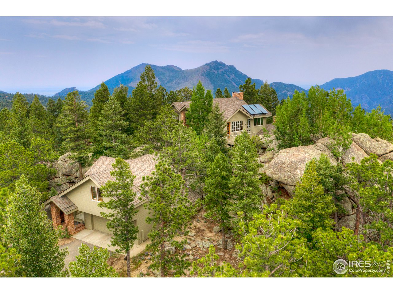 6171 Flagstaff Road Boulder, CO 80302 - Photo 2 of 40 a view of a house with a yard and a large trees
