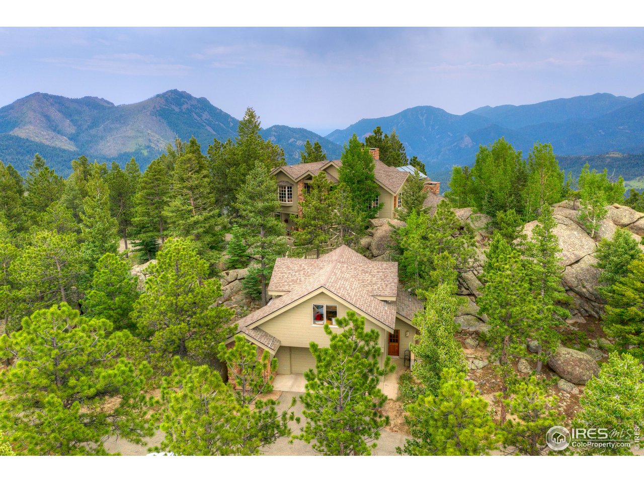 6171 Flagstaff Road Boulder, CO 80302 - Photo 32 of 40 a view of a house with a mountain in the background