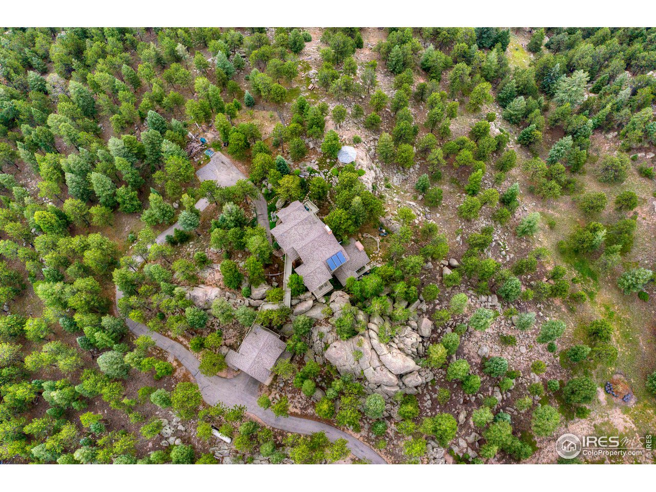 6171 Flagstaff Road Boulder, CO 80302 - Photo 34 of 40 a view of a house with a tree park in front of it