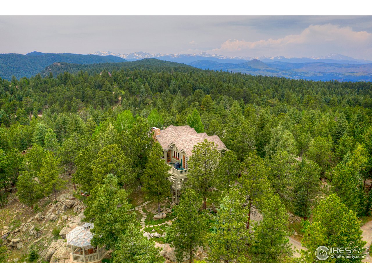6171 Flagstaff Road Boulder, CO 80302 - Photo 36 of 40 a view of a lush green hillside and a mountain