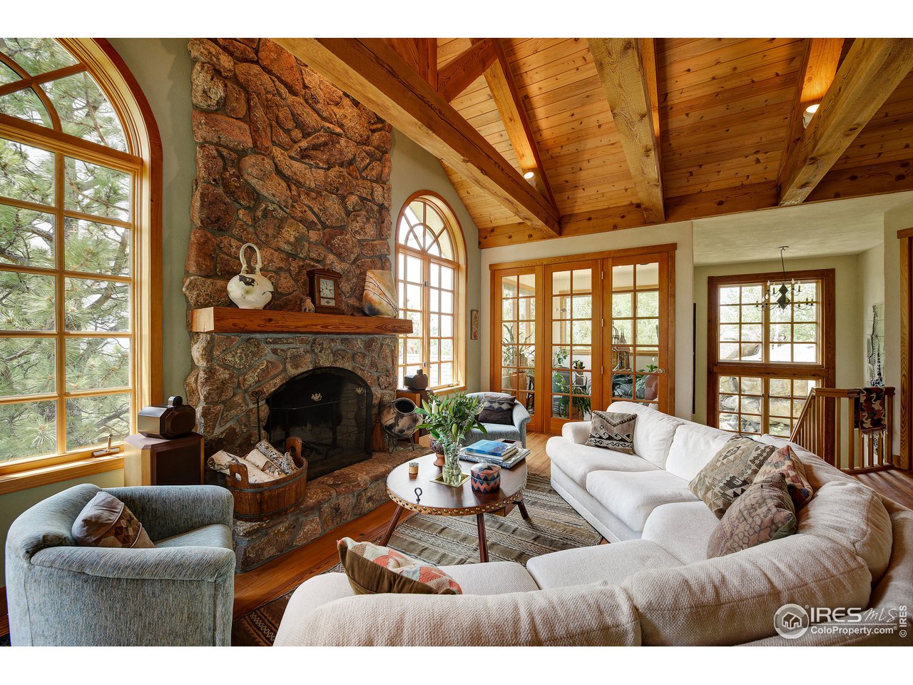 6171 Flagstaff Road Boulder, CO 80302 - Photo 5 of 40 a living room with furniture and a fireplace