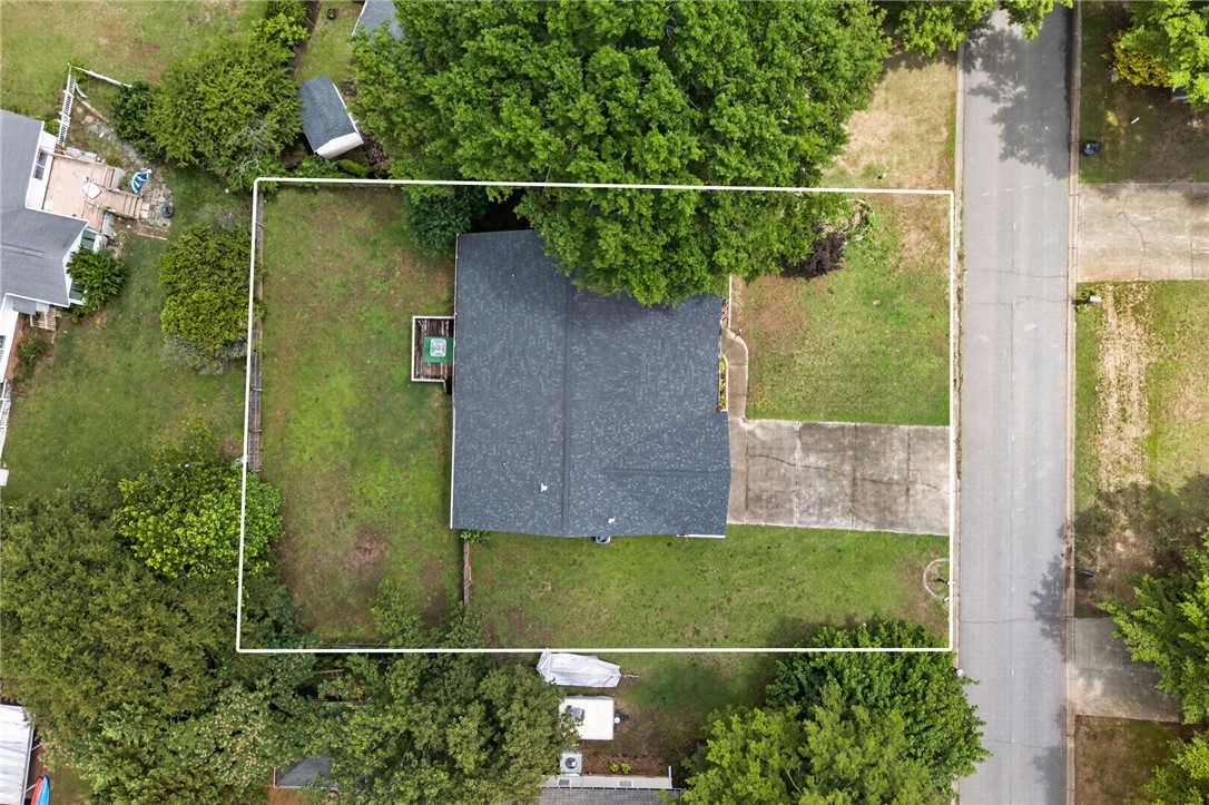 207 Hunters Lane Anderson, SC 29625 - Photo 45 of 46 An aerial view captures the property's footprint, showcasing a well-kept yard and convenient driveway access to the street.
