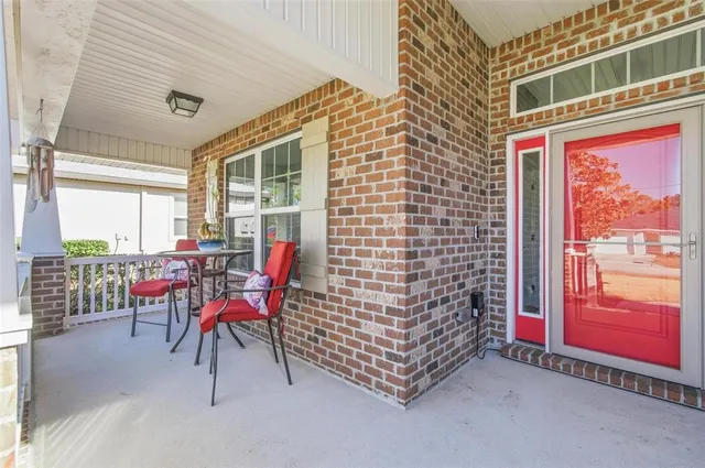 a view of a chairs and tables in the balcony