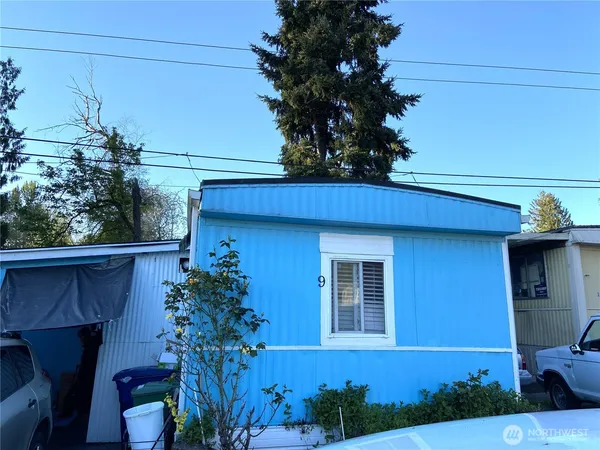 a view of a house with a flower garden