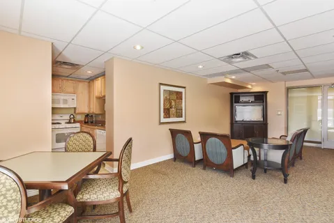 a view of parking garage with cars parked