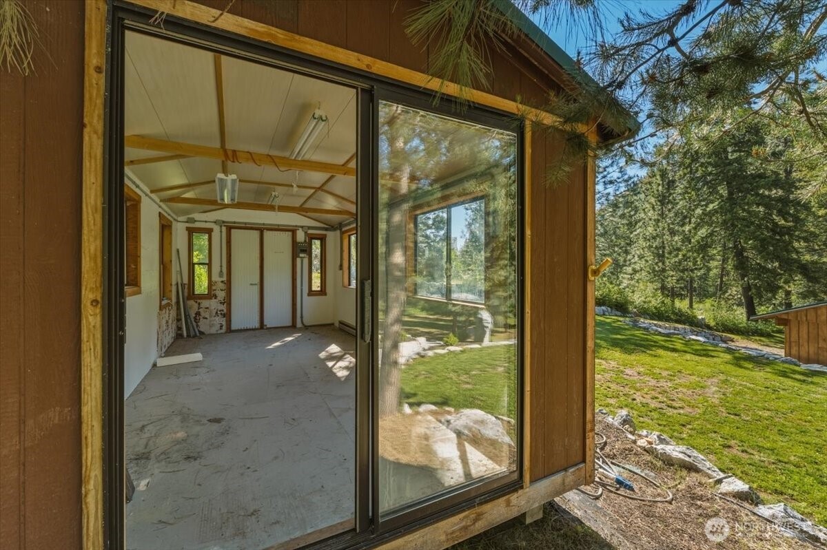 2250 First Crk Road Chelan, WA 98816 - Photo 36 of 39 a view of a porch with a floor to ceiling window and floor