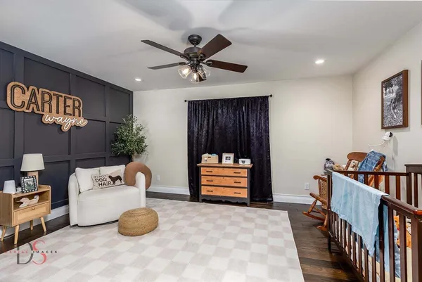 a bedroom with furniture and a window