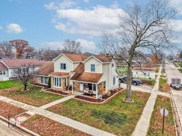 a aerial view of a house with a yard