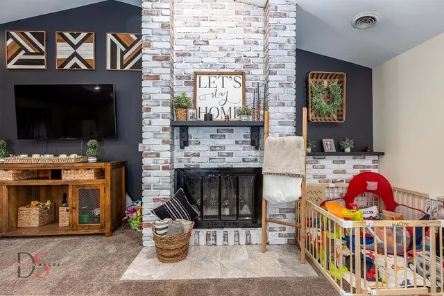 a bedroom with furniture and a flat screen tv