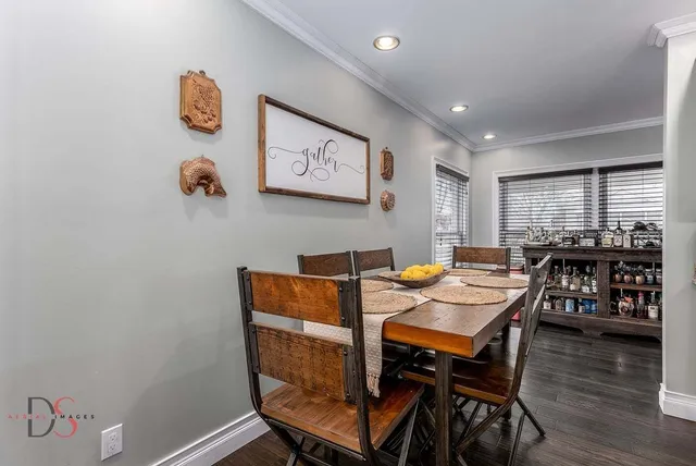 a view of a dining room with furniture and wooden floor