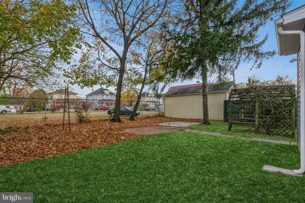 a view of a backyard with a tree