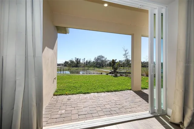 a view of a porch and a yard