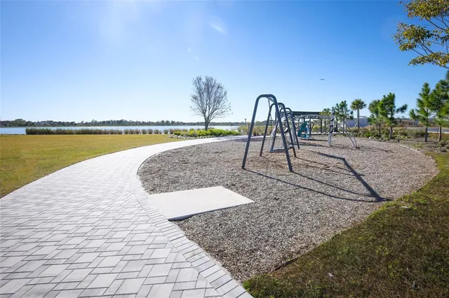 a view of a swimming pool with a patio