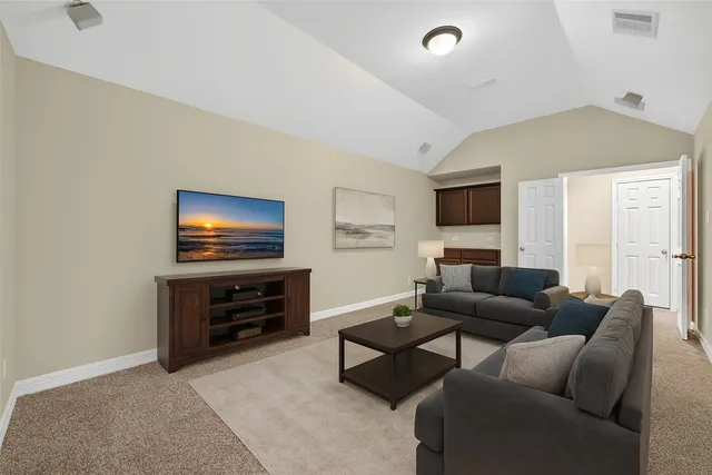 a bathroom with a tub a sink and a mirror