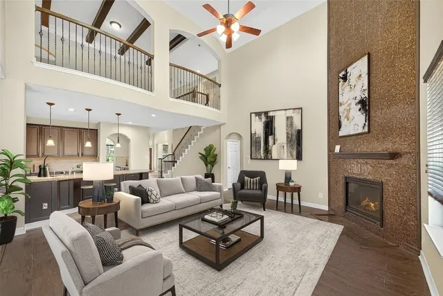 a kitchen with kitchen island granite countertop a sink cabinets and stainless steel appliances