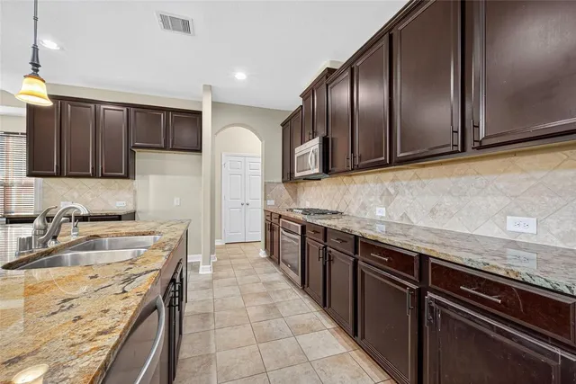 a view of a dining room with furniture and window