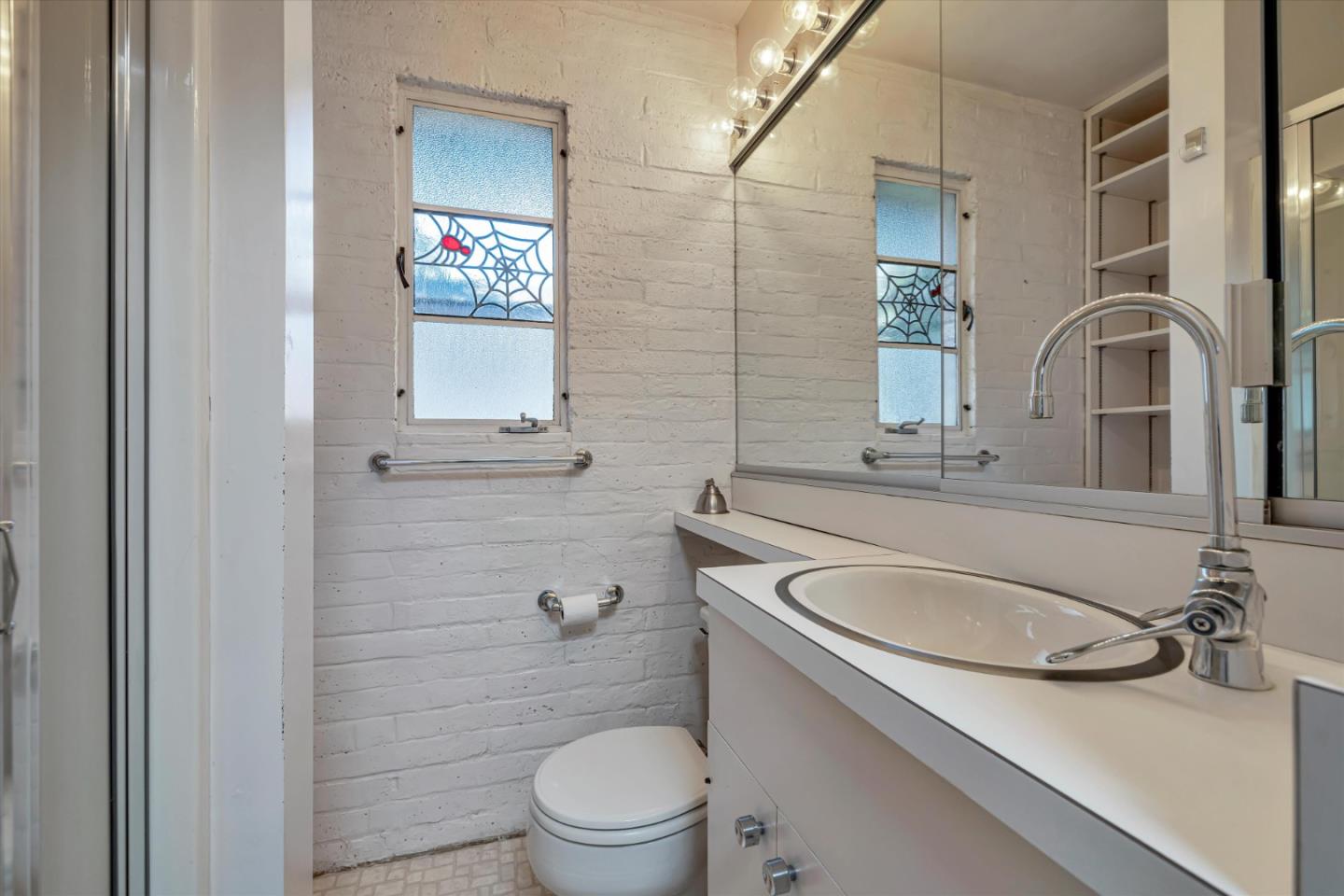4150 Rincon Circle Palo Alto, CA 94306 - Photo 22 of 32 a bathroom with a sink toilet and mirror
