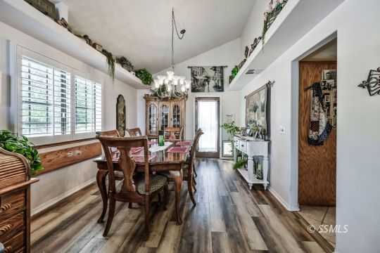 1213 Andrea Court Ridgecrest, CA 93555 - Photo 5 of 50 a view of a dining room with furniture window and wooden floor
