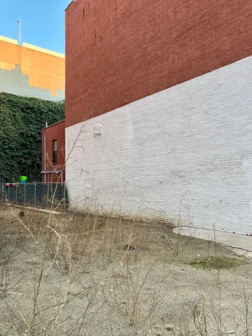 a view of a house with a street
