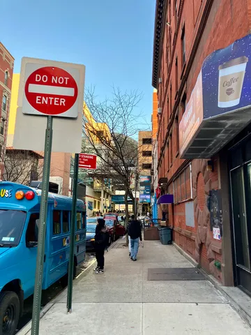 a view of a street with cars
