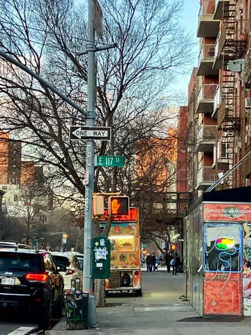 a city street lined with buildings and cars