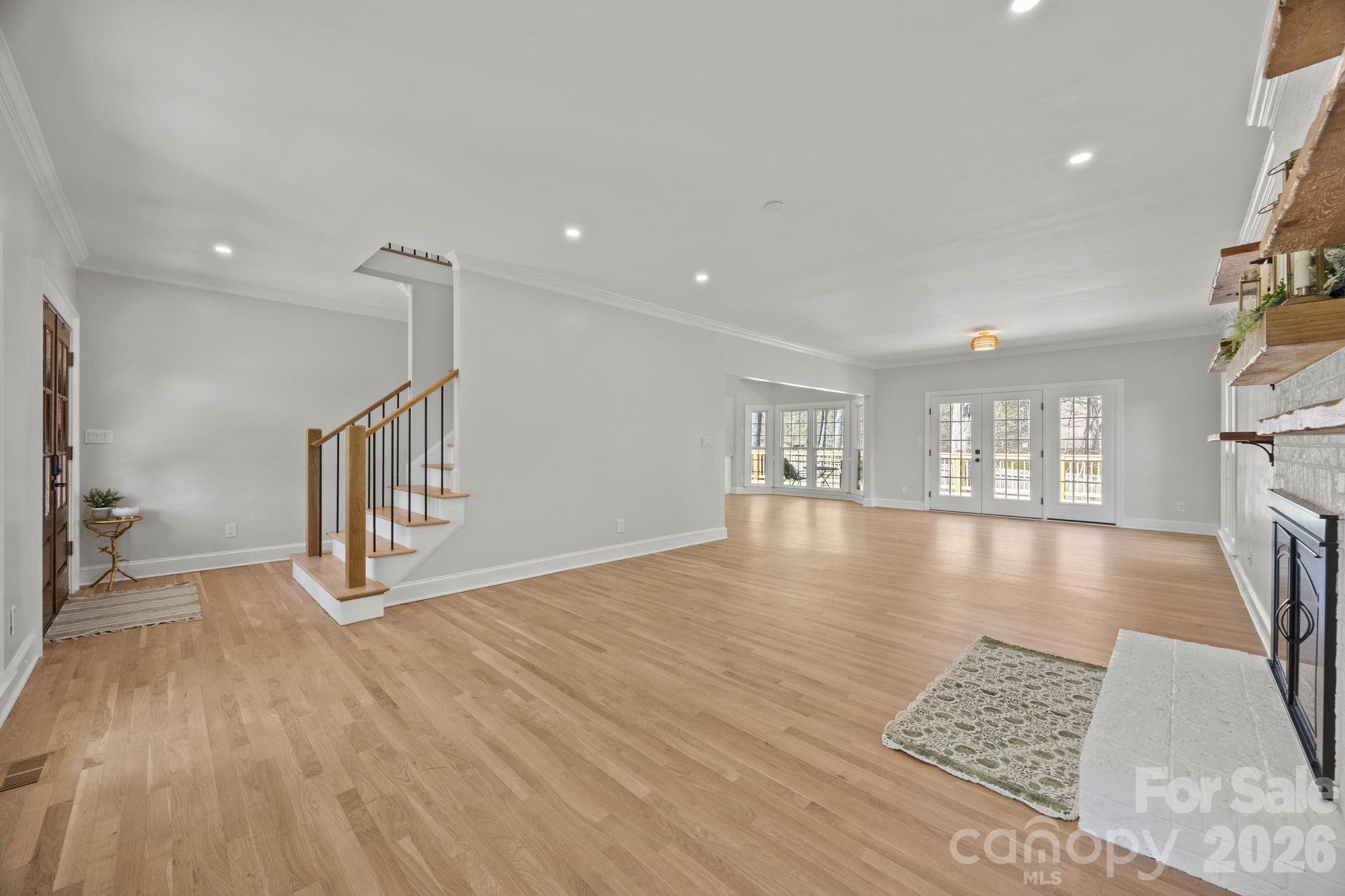 5243 Mintridge Road Mint Hill, NC 28227 - Photo 10 of 43 a view of an empty room with a window and wooden floor