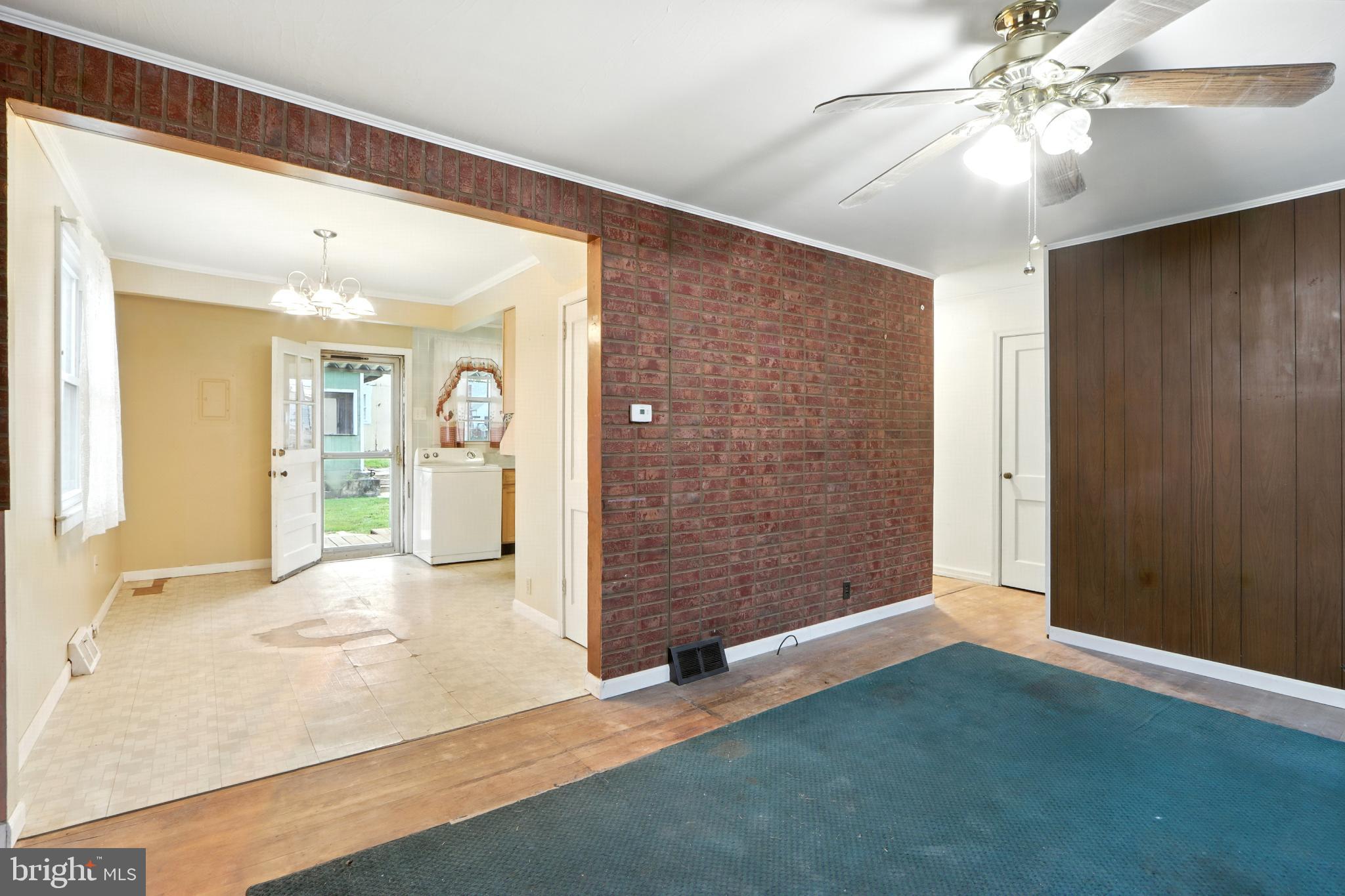 3108 Sollers Point Road Baltimore, MD 21222 - Photo 11 of 41 a view of an empty room with cabinet and a ceiling fan