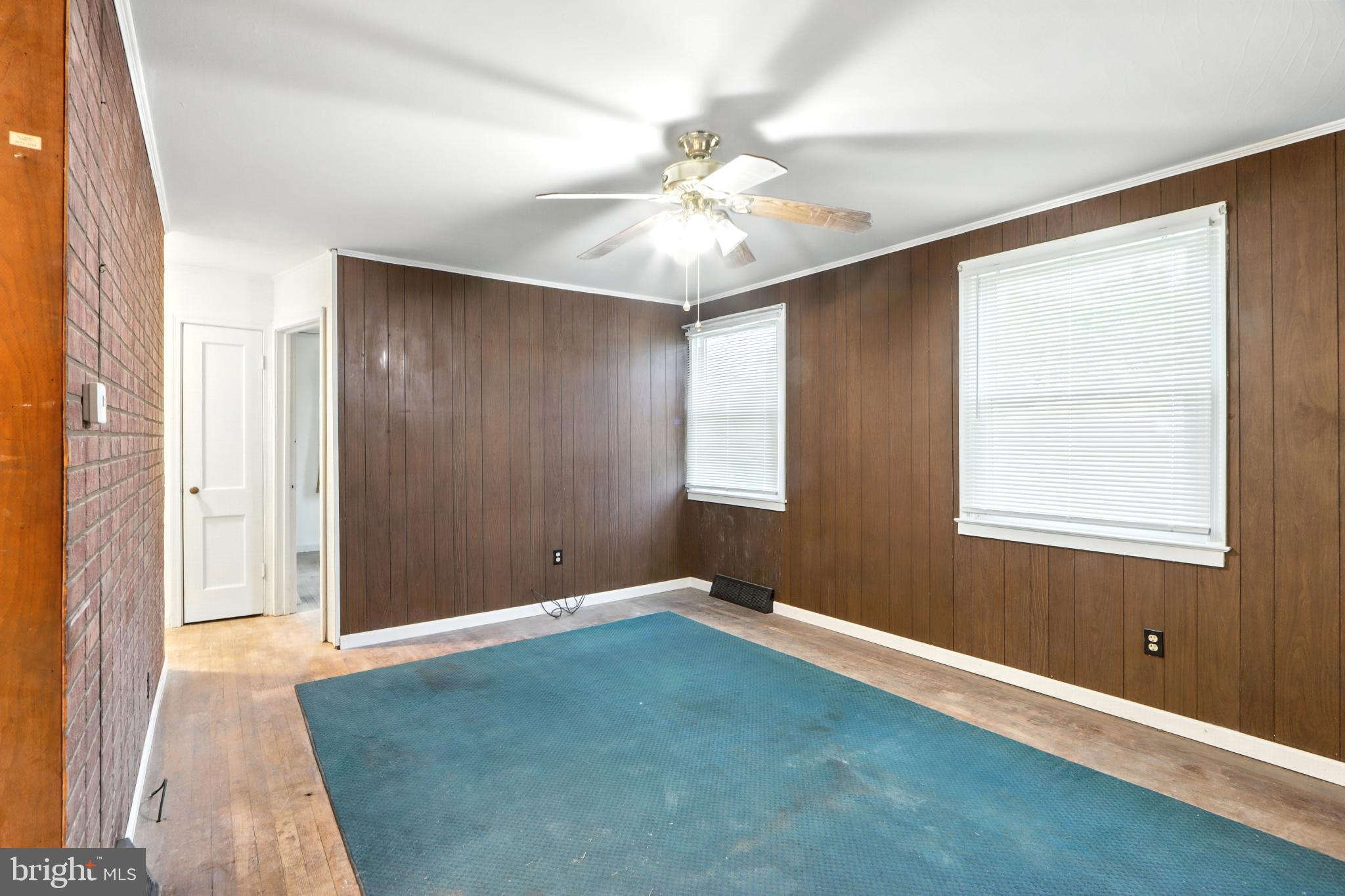 3108 Sollers Point Road Baltimore, MD 21222 - Photo 12 of 41 an empty room with windows and fan