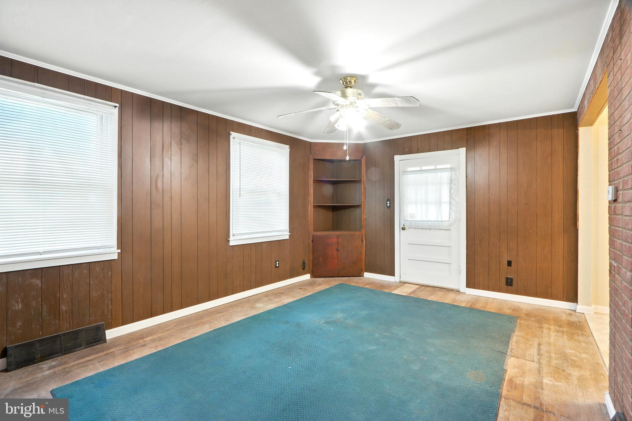 3108 Sollers Point Road Baltimore, MD 21222 - Photo 13 of 41 an empty room with windows and fan