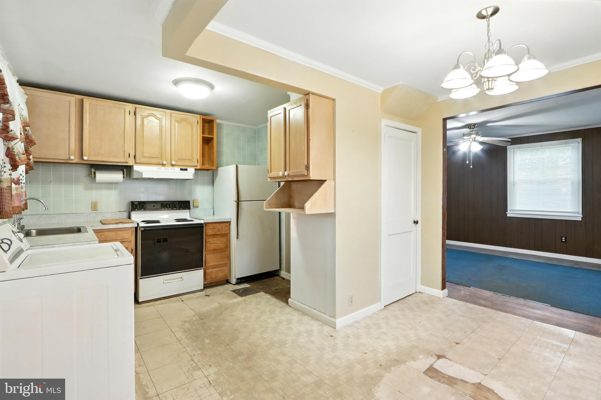 3108 Sollers Point Road Baltimore, MD 21222 - Photo 15 of 41 a kitchen that has a lot of cabinets and appliances