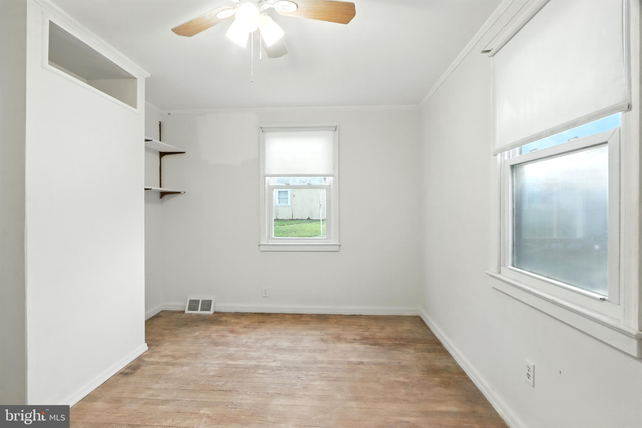 3108 Sollers Point Road Baltimore, MD 21222 - Photo 18 of 41 an empty room with a natural light