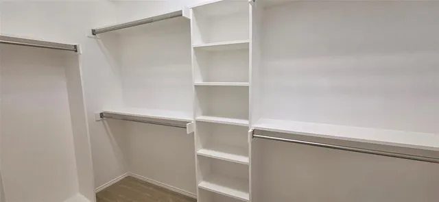a view of an empty walk in closet