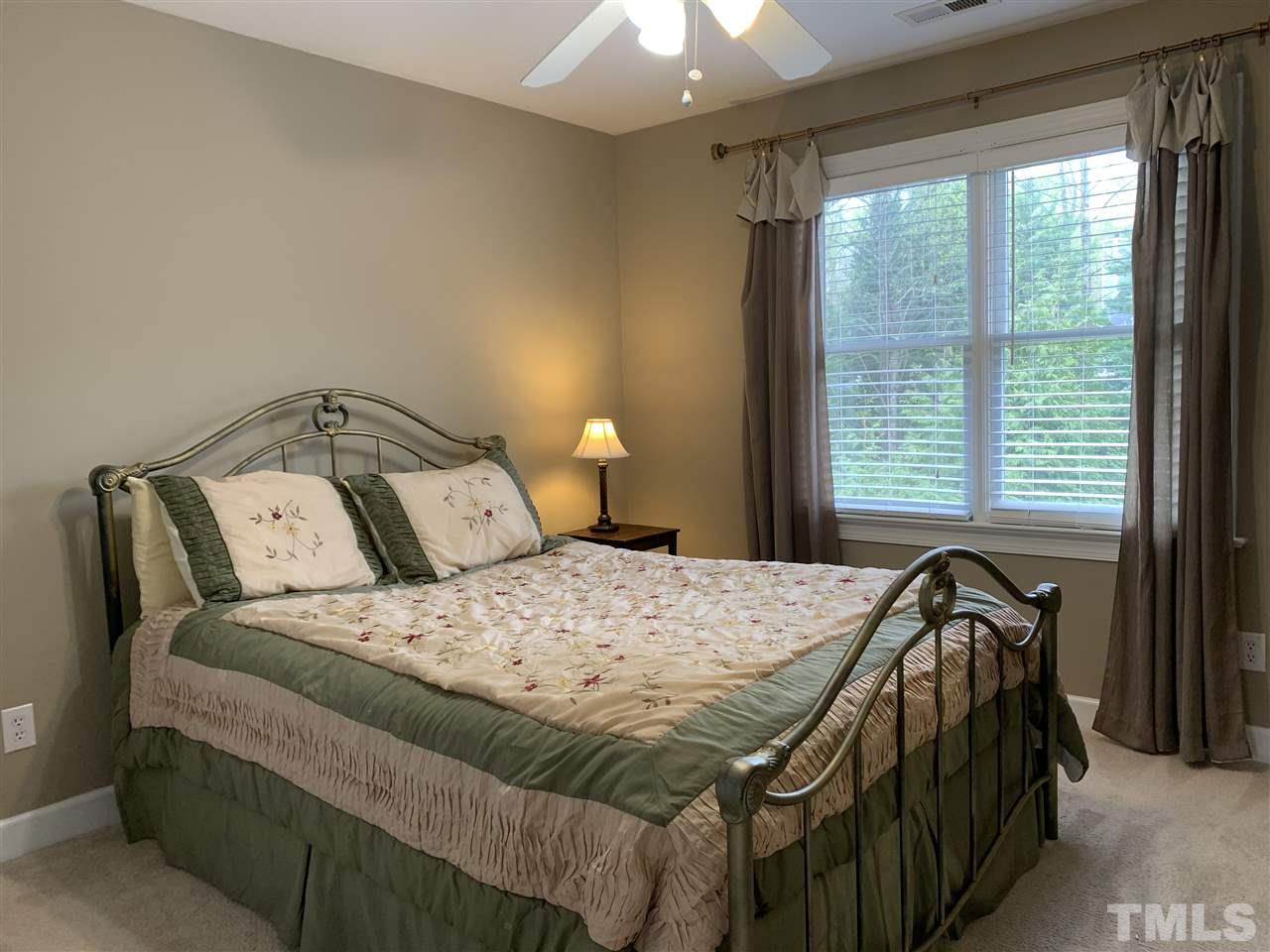 9105 Cub Trail Raleigh, NC 27615 - Photo 16 of 22 a bedroom with a bed and a window