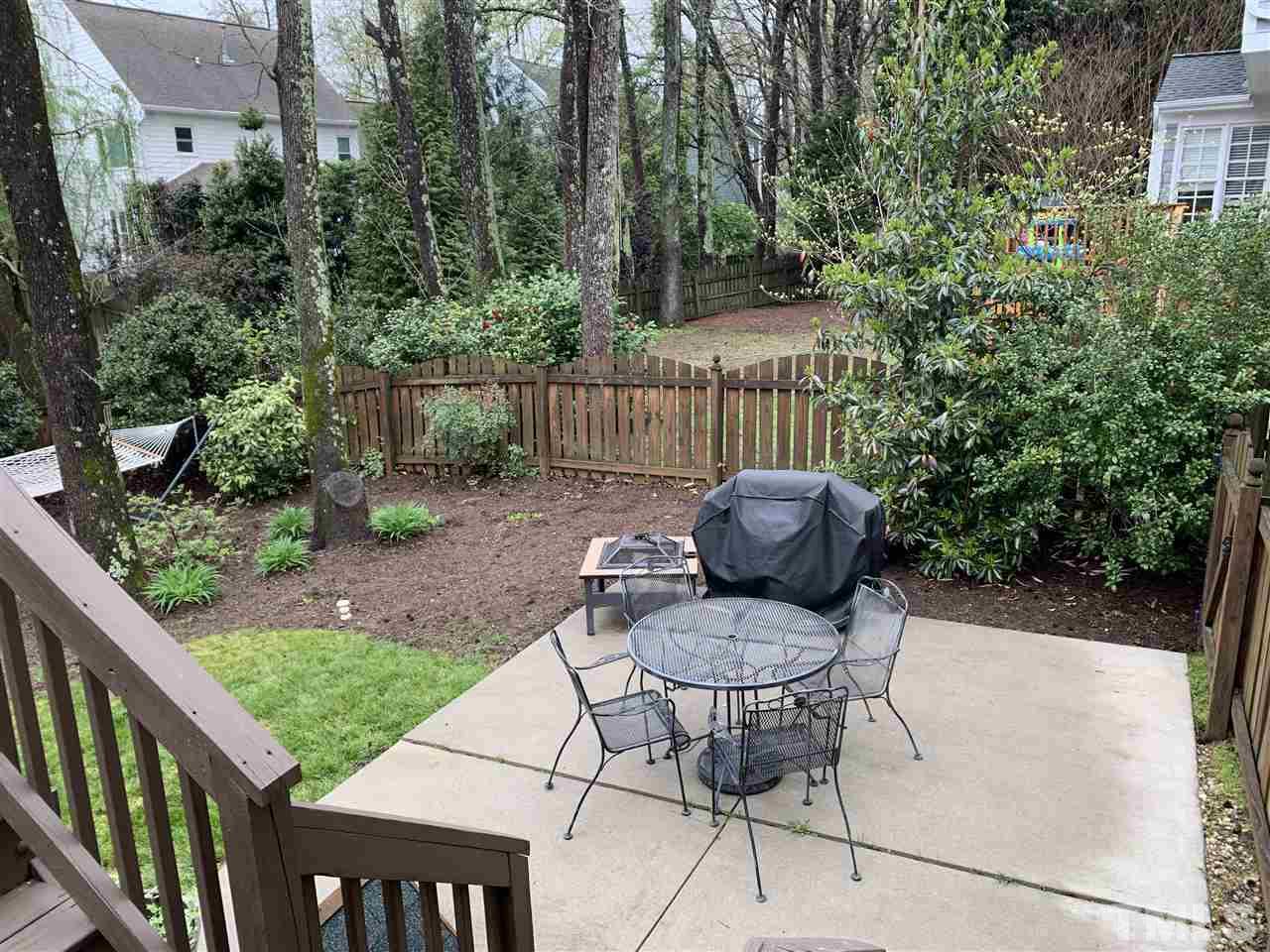 9105 Cub Trail Raleigh, NC 27615 - Photo 20 of 22 a view of a chair and table in backyard