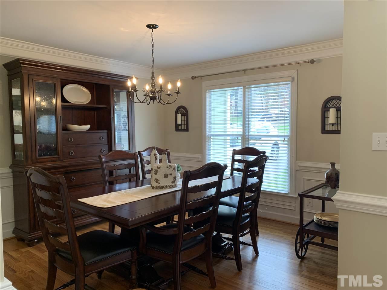 9105 Cub Trail Raleigh, NC 27615 - Photo 10 of 22 a view of a dining room with furniture and wooden floor
