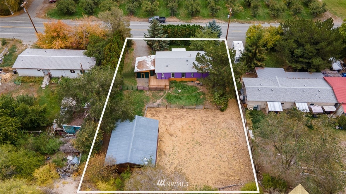 an aerial view of house with yard