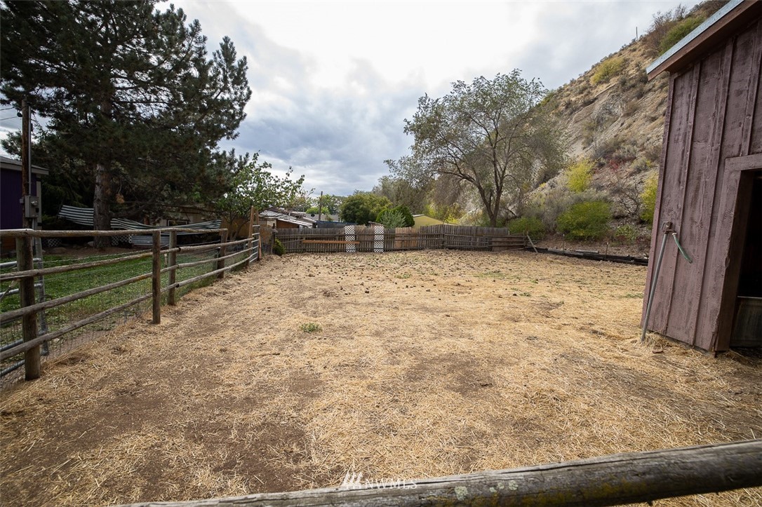 373 Conconully Road Okanogan, WA 98840 - Photo 18 of 24 a view of a yard with wooden fence