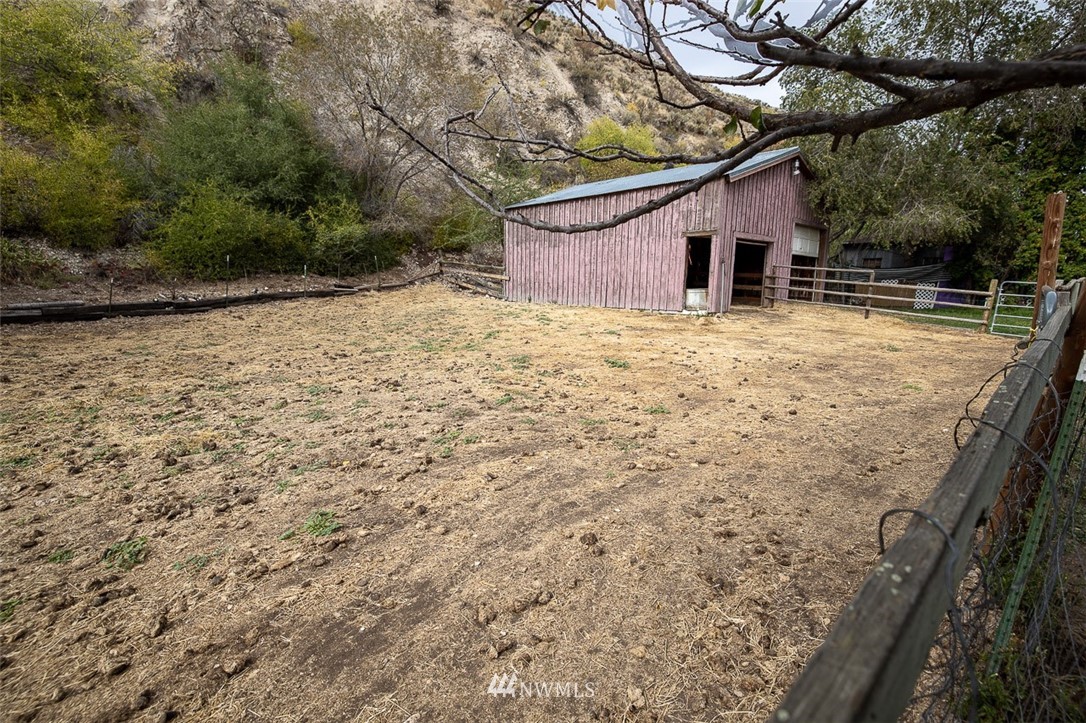 373 Conconully Road Okanogan, WA 98840 - Photo 19 of 24 a backyard of a house with lots of green space