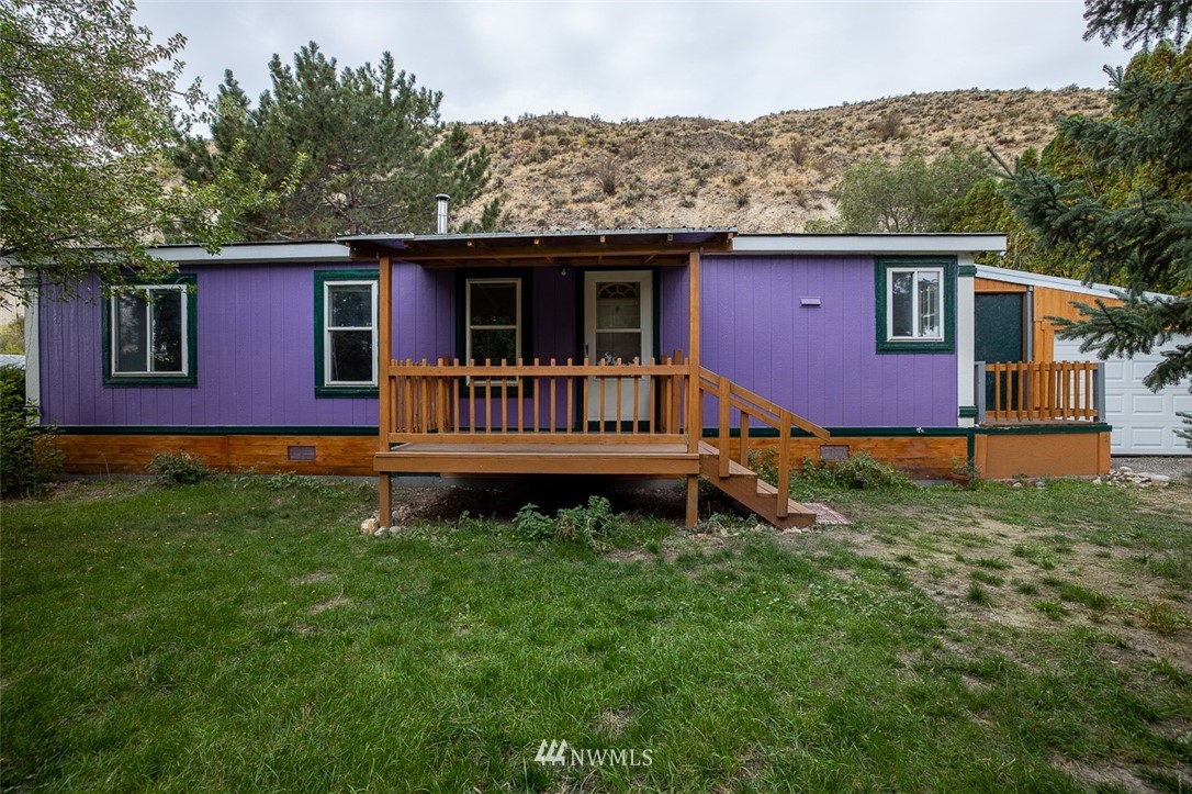 373 Conconully Road Okanogan, WA 98840 - Photo 4 of 24 a view of a house with a yard