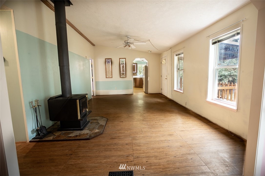 373 Conconully Road Okanogan, WA 98840 - Photo 8 of 24 a living room with furniture and a flat screen tv