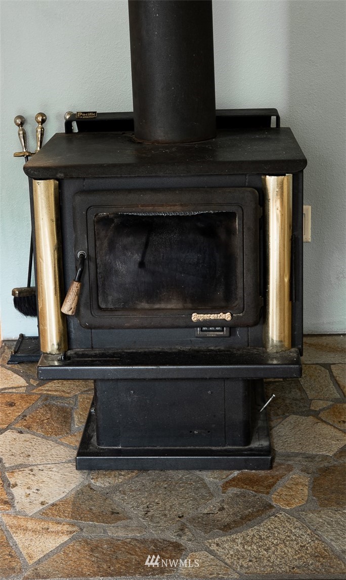 373 Conconully Road Okanogan, WA 98840 - Photo 9 of 24 a view of fireplace in front of a house